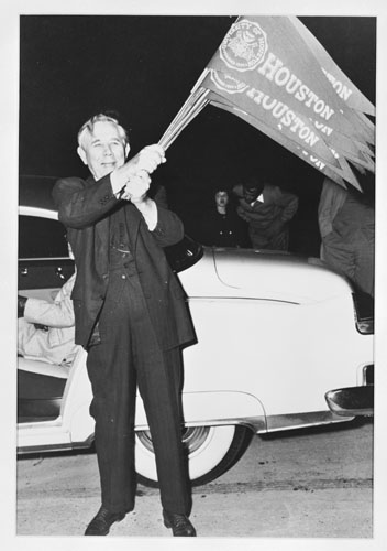 H.R. Cullen waving UH flags